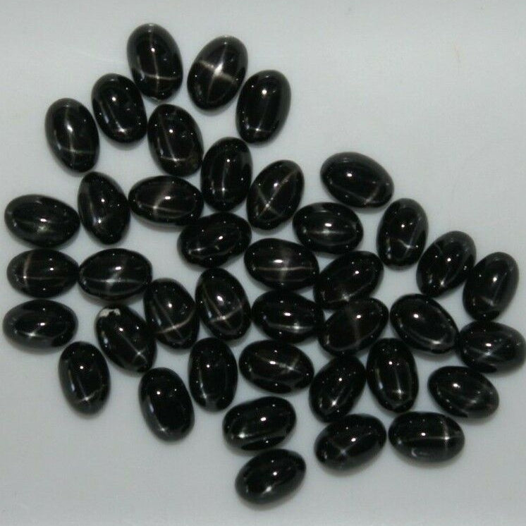 Cabochon, black star diopside, oval, 5x7mm, 1-10stk