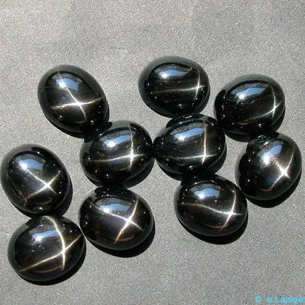 Cabochon, black star diopside, oval, 5x7mm, 1-10stk